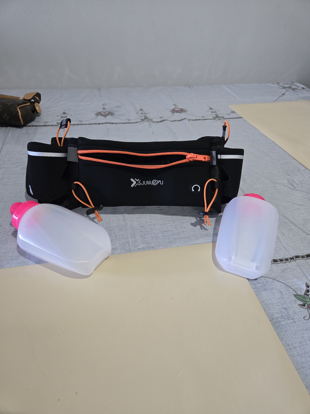 Black Running Waist Pack with Orange Accents and Dual Soft Flasks